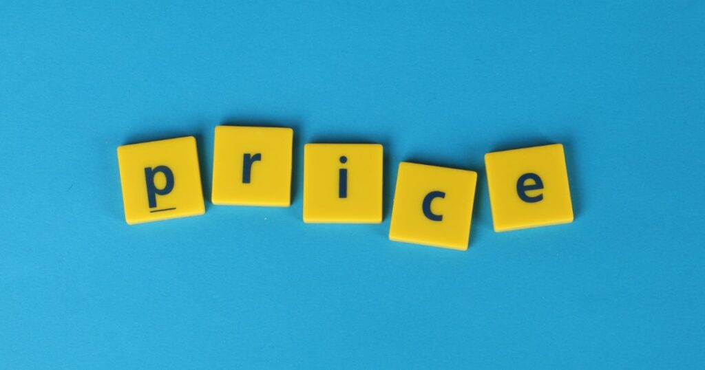 Letter tiles spelling the word price on a blue background.