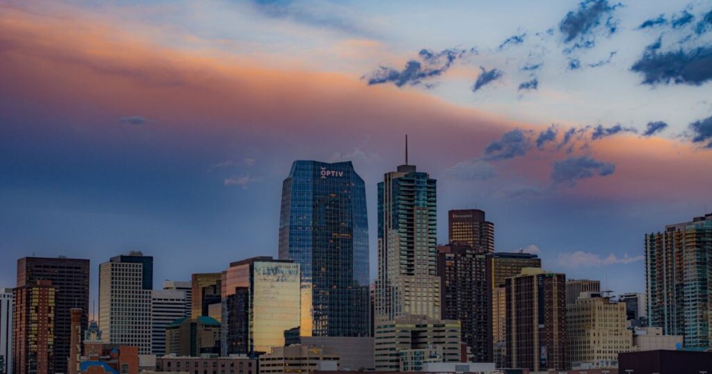 Denver skyline under a colorful sunset sky, Colorado.